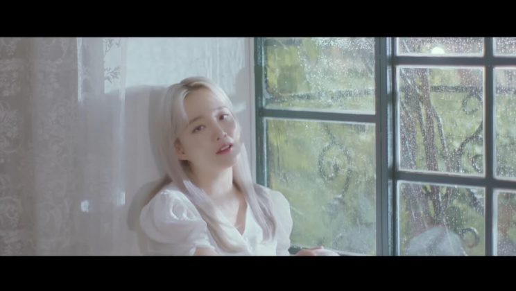 Younha sits by the window in ‘Rain Song’ special MV